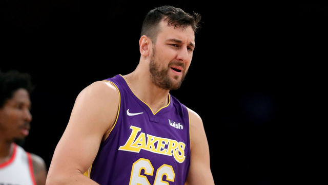 LOS ANGELES, CA - DECEMBER 23: Andrew Bogut #66 of the Los Angeles Lakers reacts to fouling out as Ed Davis #17 of the Portland Trail Blazers looks on during the second half of a game at Staples Center on December 23, 2017 in Los Angeles, California.