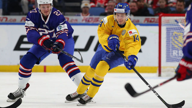 BUFFALO, NY - JANUARY 4: Riley Tufte #27 of United States pursues Elias Pettersson #14 of Sweden in the first period during the IIHF World Junior Championship at KeyBank Center on January 4, 2018 in Buffalo, New York.
