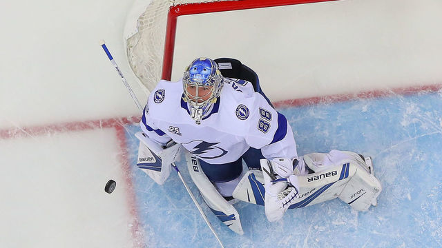 NEWARK, NJ - APRIL 18: Tampa Bay Lightning goaltender Andrei Vasilevskiy (88) makes a save during the first period of the First Round Stanley Cup Playoff Game 4 between the New Jersey Devils and the Tampa Bay Lightning on April 18, 2018, at the Prudential Center in Newark, NJ.