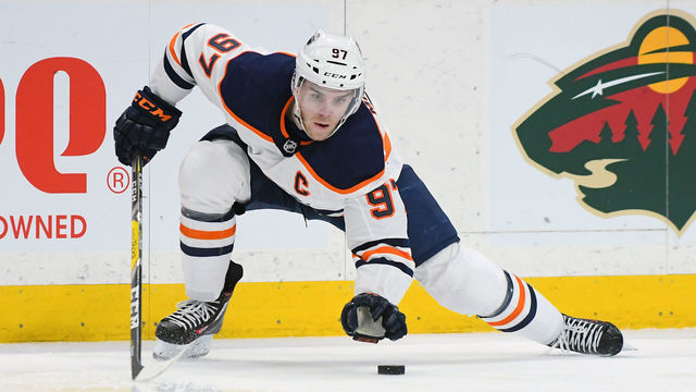 ST. PAUL, MN - APRIL 02: Edmonton Oilers Center Connor McDavid (97) plays the puck with his glove hand during a NHL game between the Minnesota Wild and Edmonton Oilers on April 2, 2018 at Xcel Energy Center in St. Paul, MN. The Wild Defeated the Oilers 3-0.