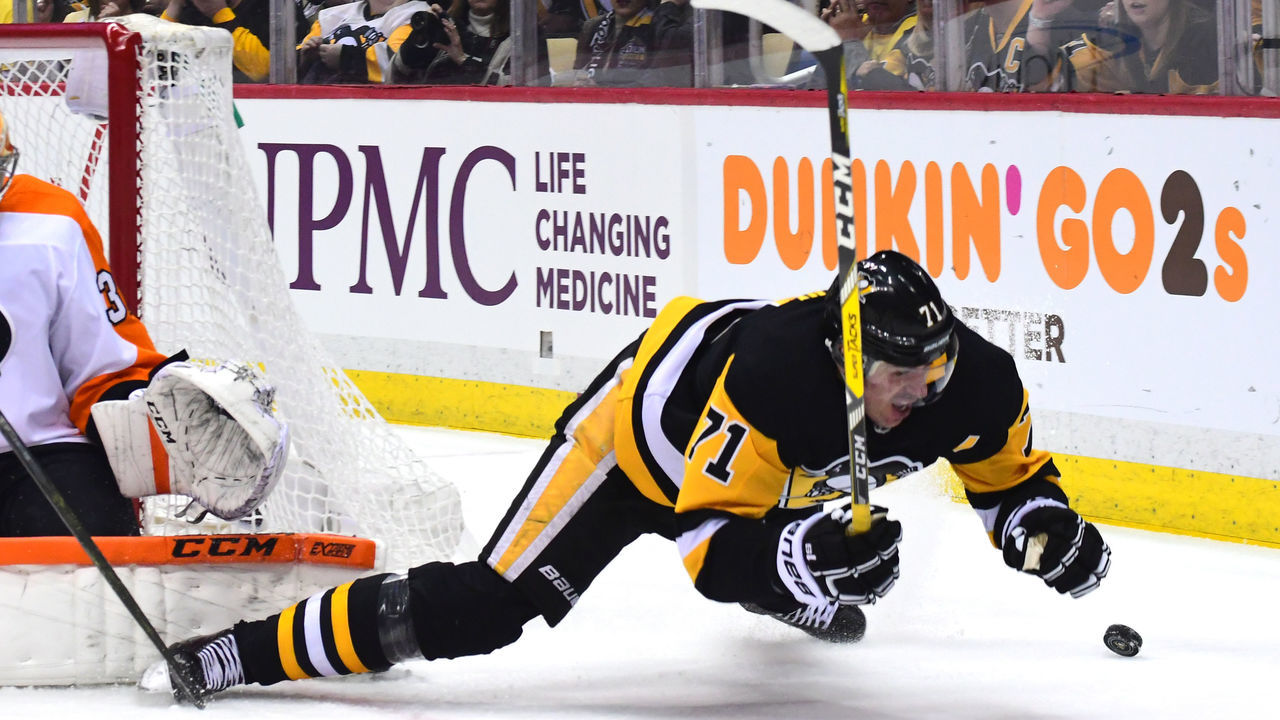 PITTSBURGH, PA - APRIL 20: Evgeni Malkin #71 of the Pittsburgh Penguins falls to the ice against the Philadelphia Flyers in Game Five of the Eastern Conference First Round during the 2018 NHL Stanley Cup Playoffs at PPG PAINTS Arena on April 20, 2018 in Pittsburgh, Pennsylvania.