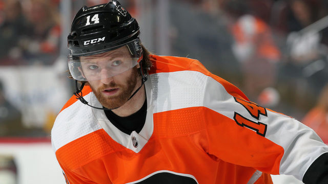 PHILADELPHIA, PA - APRIL 15: Sean Couturier #14 of the Philadelphia Flyers looks on against the Pittsburgh Penguins in Game Three of the Eastern Conference First Round during the 2018 NHL Stanley Cup Playoffs at the Wells Fargo Center on April 15, 2018 in Philadelphia, Pennsylvania.