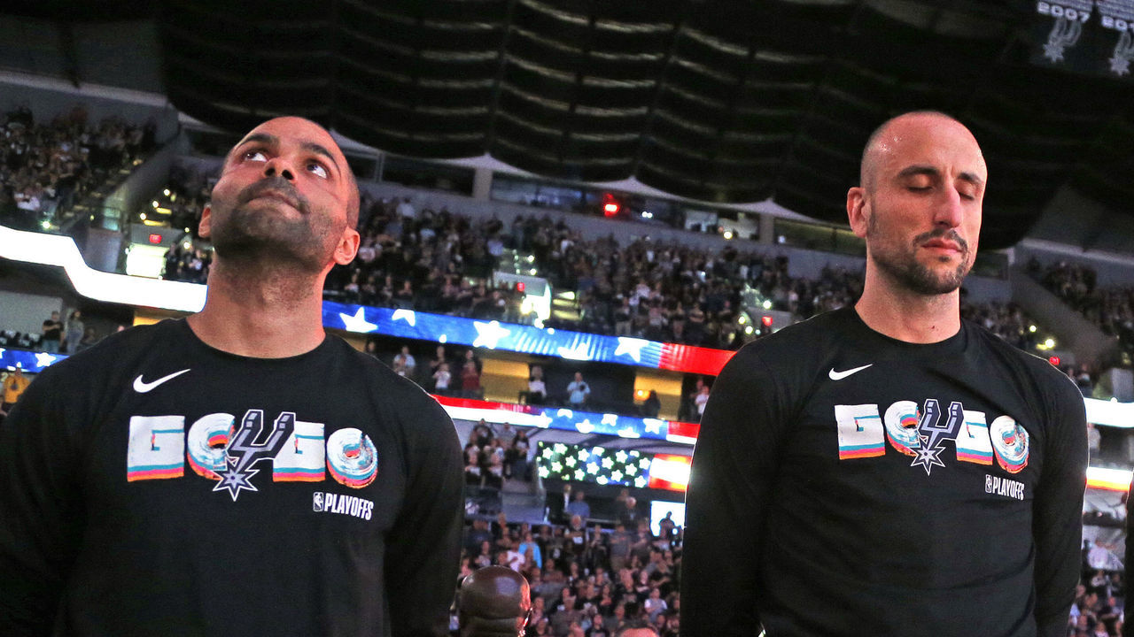 SAN ANTONIO,TX - APRIL 22 : Tony Parker #9 and Manu Ginobili #20 of the San Antonio Spurs stand for the national anthem before the start of Game Four of Round One of the 2018 NBA Playoffs San Antonio Spurs at AT&T Center on April 22 , 2018 in San Antonio, Texas. NOTE TO USER: User expressly acknowledges and agrees that , by downloading and or using this photograph, User is consenting to the terms and conditions of the Getty Images License Agreement.