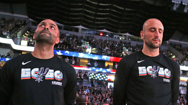 SAN ANTONIO,TX - APRIL 22 : Tony Parker #9 and Manu Ginobili #20 of the San Antonio Spurs stand for the national anthem before the start of Game Four of Round One of the 2018 NBA Playoffs San Antonio Spurs at AT&T Center on April 22 , 2018 in San Antonio, Texas. NOTE TO USER: User expressly acknowledges and agrees that , by downloading and or using this photograph, User is consenting to the terms and conditions of the Getty Images License Agreement.