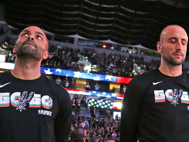 SAN ANTONIO,TX - APRIL 22 : Tony Parker #9 and Manu Ginobili #20 of the San Antonio Spurs stand for the national anthem before the start of Game Four of Round One of the 2018 NBA Playoffs San Antonio Spurs at AT&T Center on April 22 , 2018 in San Antonio, Texas. NOTE TO USER: User expressly acknowledges and agrees that , by downloading and or using this photograph, User is consenting to the terms and conditions of the Getty Images License Agreement.