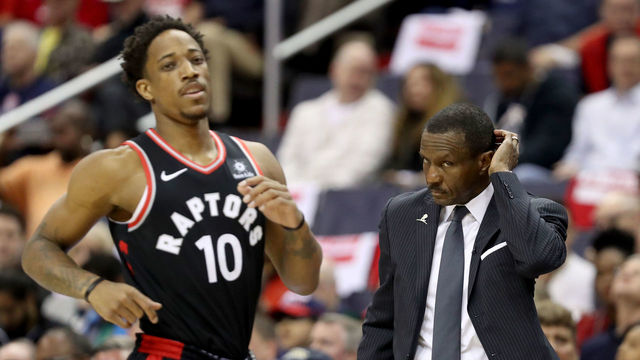 WASHINGTON, DC - APRIL 22: DeMar DeRozan #10 of the Toronto Raptors runs up the floor as head coach Dwane Casey looks on against the Washington Wizards during Game Four of Round One of the 2018 NBA Playoffs at Capital One Arena on April 22, 2018 in Washington, DC.