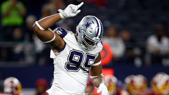 ARLINGTON, TX - NOVEMBER 30: David Irving #95 of the Dallas Cowboys runs off the field after a 38-14 win over the Washington Redskins at AT&T Stadium on November 30, 2017 in Arlington, Texas.