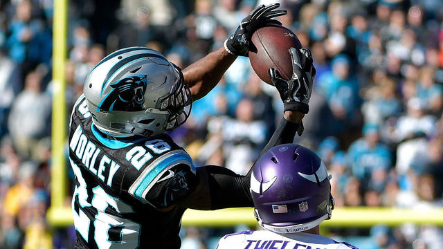 CHARLOTTE, NC - DECEMBER 10: Daryl Worley #26 of the Carolina Panthers intercepts the ball against Adam Thielen #19 of the Minnesota Vikings in the first quarter during their game at Bank of America Stadium on December 10, 2017 in Charlotte, North Carolina.