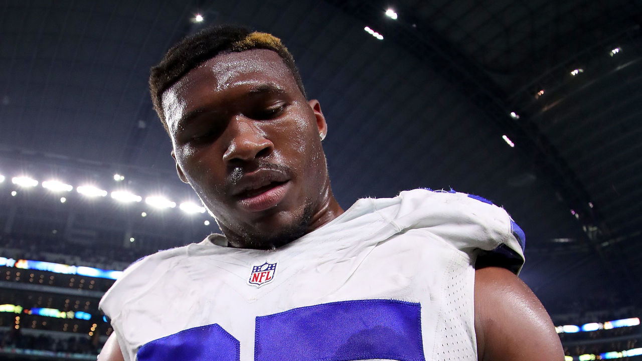ARLINGTON, TX - DECEMBER 18: David Irving #95 of the Dallas Cowboys signs the game ball after the Dallas Cowboys beat the Tampa Bay Buccaneers 26-20 at AT&T Stadium on December 18, 2016 in Arlington, Texas.