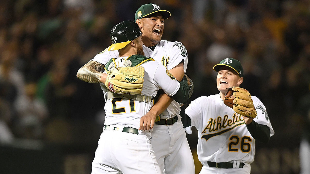 OAKLAND, CA - APRIL 21: Sean Manaea #55, Jonathan Lucroy #21 and Matt Chapman #26 of the Oakland Athletics celebrates after Manaea pitched a no-hitter against the Boston Red Sox at the Oakland Alameda Coliseum on April 21, 2018 in Oakland, California. The Athletics won the game 3-0.