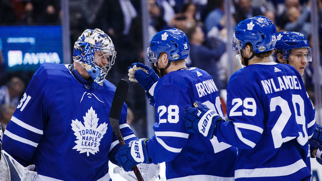 TORONTO, ON - APRIL 23: Frederik Andersen #31 of the Toronto Maple Leafs is congratulated by teammates Connor Brown #28 and William Nylander #29 in Game Six of the Eastern Conference First Round during the 2018 NHL Stanley Cup Playoffs at the Air Canada Centre on April 23, 2018 in Toronto, Ontario, Canada.