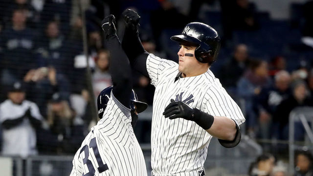 NEW YORK, NY - APRIL 20: Tyler Austin #26 of the New York Yankees celebrates his two run home run with teamamte Aaron Hicks #31 in the second inning against the Toronto Blue Jays at Yankee Stadium on April 20, 2018 in the Bronx borough of New York City.