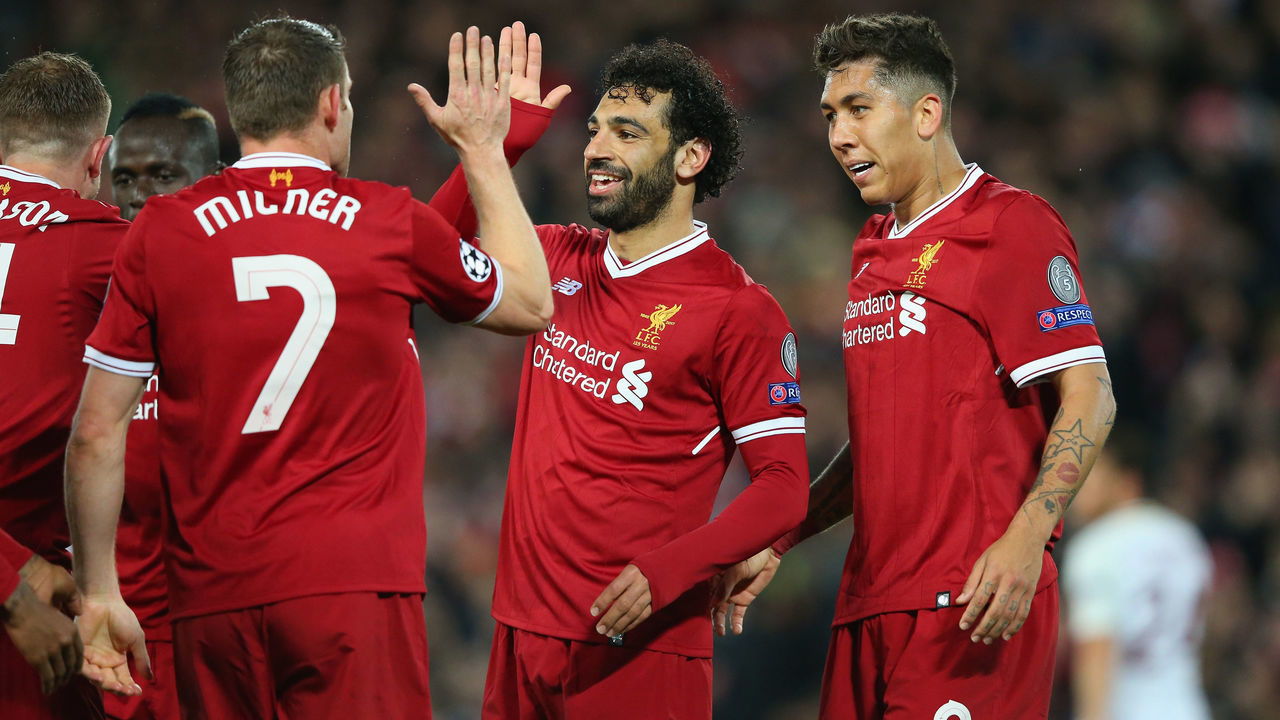 LIVERPOOL, ENGLAND - APRIL 24: Mohamed Salah of Liverpool celebrates with team mates after Sadio Mane of Liverpool scores their third goal during the UEFA Champions League Semi Final First Leg match between Liverpool and A.S. Roma at Anfield on April 24, 2018 in Liverpool, United Kingdom.
