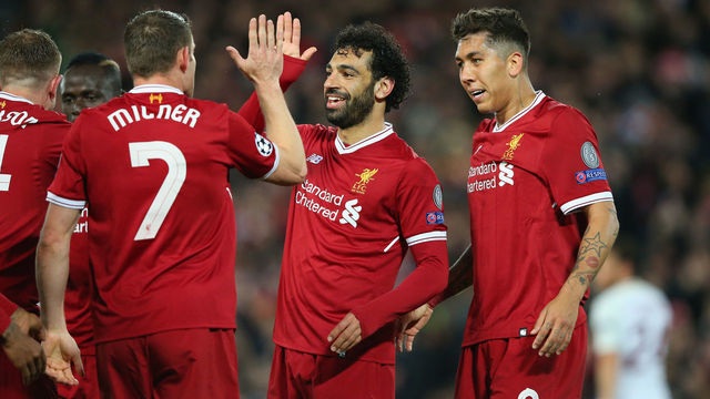 LIVERPOOL, ENGLAND - APRIL 24: Mohamed Salah of Liverpool celebrates with team mates after Sadio Mane of Liverpool scores their third goal during the UEFA Champions League Semi Final First Leg match between Liverpool and A.S. Roma at Anfield on April 24, 2018 in Liverpool, United Kingdom.