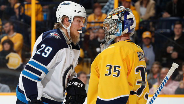 NASHVILLE, TN - MARCH 13: Pekka Rinne #35 of the Nashville Predators screens Patrik Laine #29 of the Winnipeg Jets during an NHL game at Bridgestone Arena on March 13, 2018 in Nashville, Tennessee.
