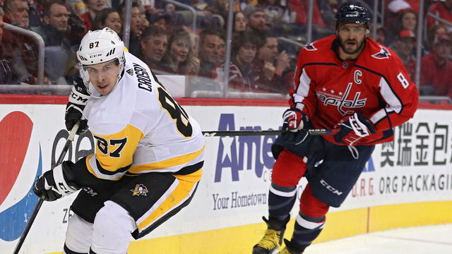 WASHINGTON, DC - NOVEMBER 10: Sidney Crosby #87 of the Pittsburgh Penguins skates past Alex Ovechkin #8 of the Washington Capitals during the second period at Capital One Arena on November 10, 2017 in Washington, DC.