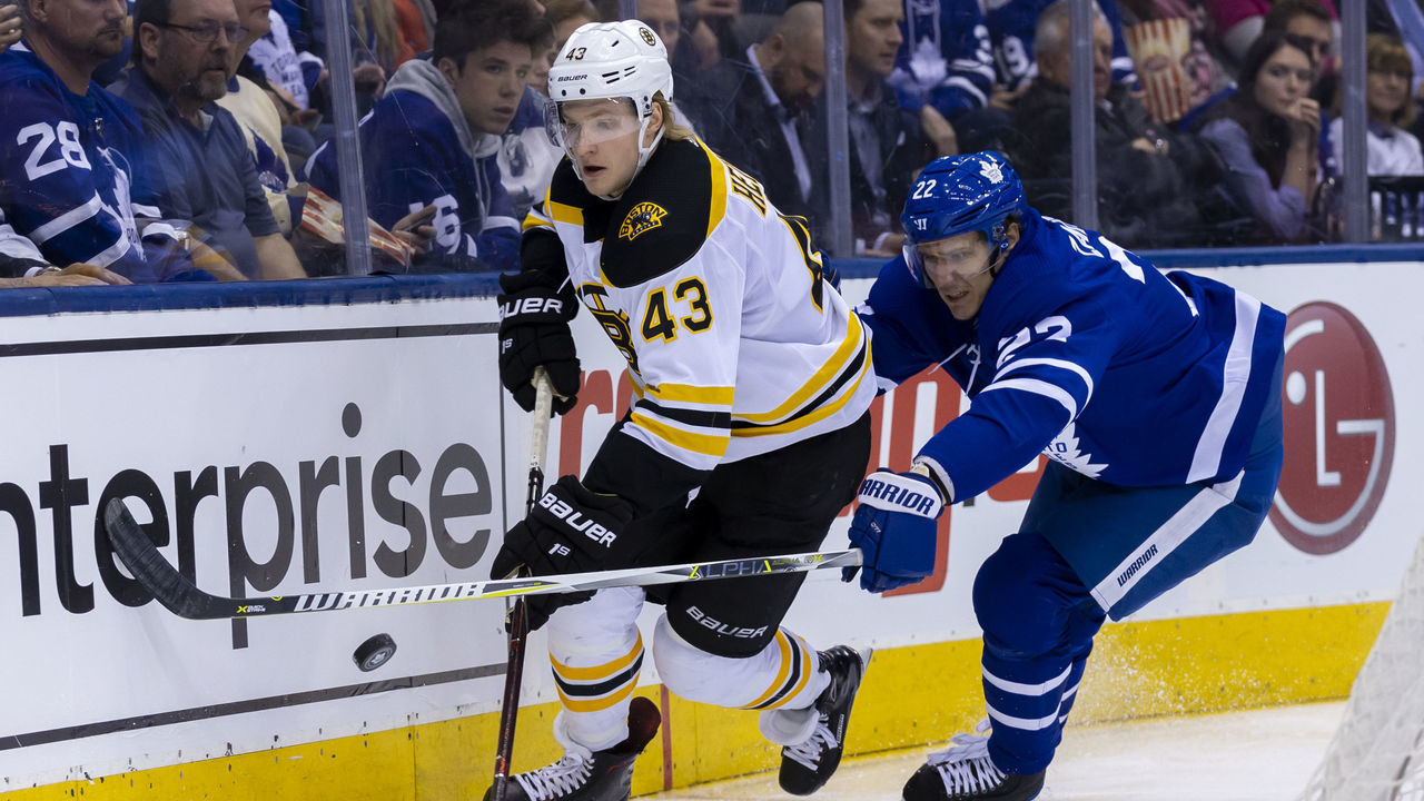 TORONTO, ON - APRIL 19: Nikita Zaitsev #22 of the Toronto Maple Leafs chases Danton Heinen #43 of the Boston Bruins in Game Four of the Eastern Conference First Round during the 2018 NHL Stanley Cup Playoffs at the Air Canada Centre on April 19, 2018 in Toronto, Ontario, Canada.