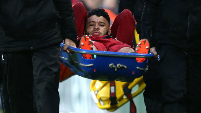 LIVERPOOL, ENGLAND - APRIL 24: Alex Oxlade-Chamberlain of Liverpool leaves the pitch on a stretcher during the UEFA Champions League Semi Final First Leg match between Liverpool and A.S. Roma at Anfield on April 24, 2018 in Liverpool, United Kingdom.