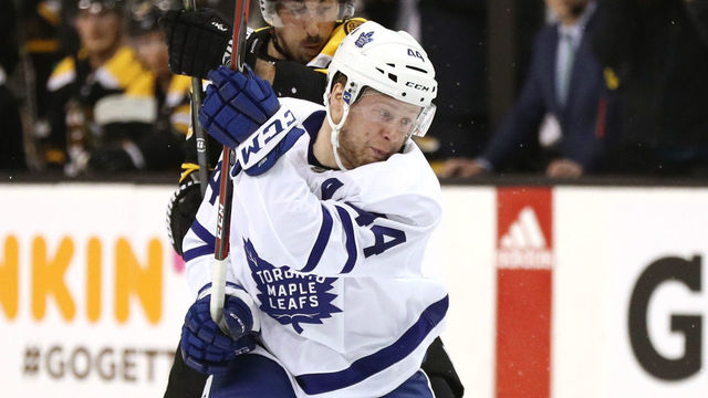 BOSTON, MA - APRIL 21: Brad Marchand #63 of the Boston Bruins defends Morgan Rielly #44 of the Toronto Maple Leafs during the first period of Game Five of the Eastern Conference First Round in the 2018 Stanley Cup play-offs at TD Garden on April 21, 2018 in Boston, Massachusetts.
