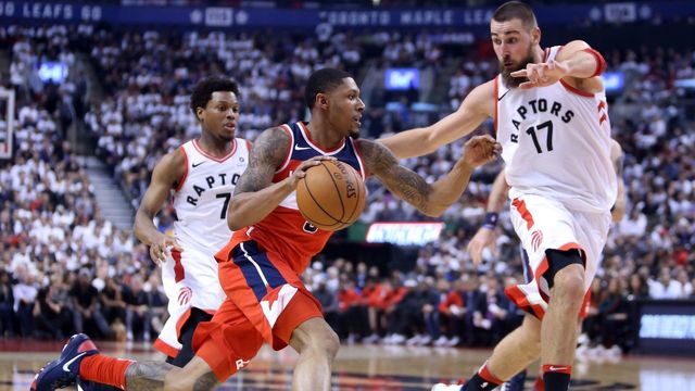 TORONTO, ON - APRIL 25: Bradley Beal #3 of the Washington Wizards drives to the basket as Jonas Valanciunas #17 of the Toronto Raptors defends during the first half of Game Five in Round One of the 2018 NBA playoffs at Air Canada Centre on April 25, 2018 in Toronto, Canada.