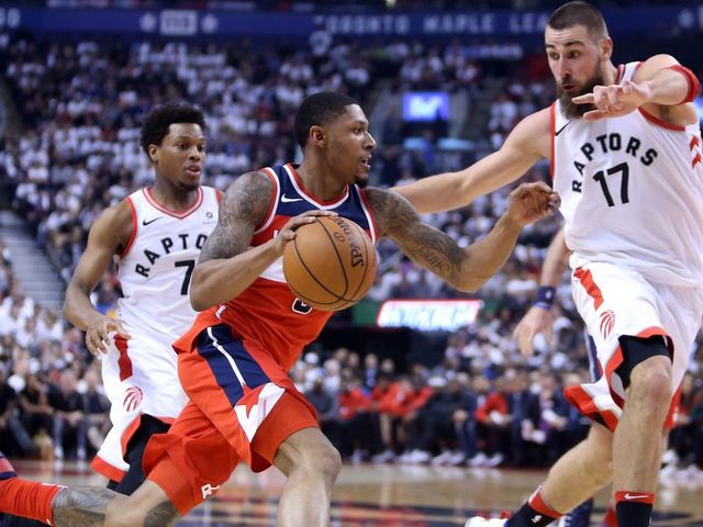 TORONTO, ON - APRIL 25: Bradley Beal #3 of the Washington Wizards drives to the basket as Jonas Valanciunas #17 of the Toronto Raptors defends during the first half of Game Five in Round One of the 2018 NBA playoffs at Air Canada Centre on April 25, 2018 in Toronto, Canada.
