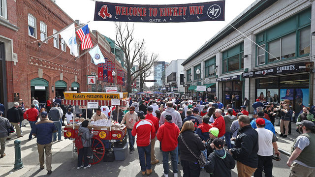 BOSTON, MA - APRIL 3: Fans walk down Yawkey Way before the opening day game between the Boston Red Sox and the Pittsburgh Pirates at Fenway Park on April 3, 2017 in Boston, Massachusetts.