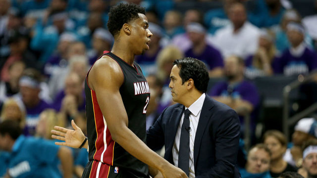 CHARLOTTE, NC - APRIL 25: Head coach Erik Spoelstra stands with his player Hassan Whiteside #21 of the Miami Heat against the Charlotte Hornets during game four of the Eastern Conference Quarterfinals of the 2016 NBA Playoffs at Time Warner Cable Arena on April 25, 2016 in Charlotte, North Carolina.