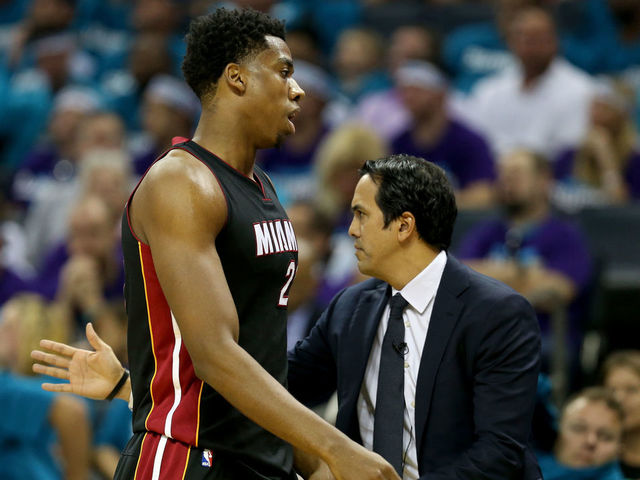 CHARLOTTE, NC - APRIL 25: Head coach Erik Spoelstra stands with his player Hassan Whiteside #21 of the Miami Heat against the Charlotte Hornets during game four of the Eastern Conference Quarterfinals of the 2016 NBA Playoffs at Time Warner Cable Arena on April 25, 2016 in Charlotte, North Carolina.