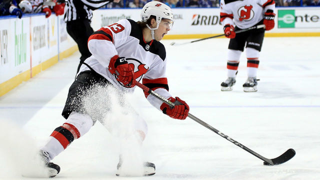 TAMPA, FL - APRIL 12: Nico Hischier #13 of the New Jersey Devils shoots during Game One of the Eastern Conference First Round against the Tampa Bay Lightning during the 2018 NHL Stanley Cup Playoffs at Amalie Arena on April 12, 2018 in Tampa, Florida.