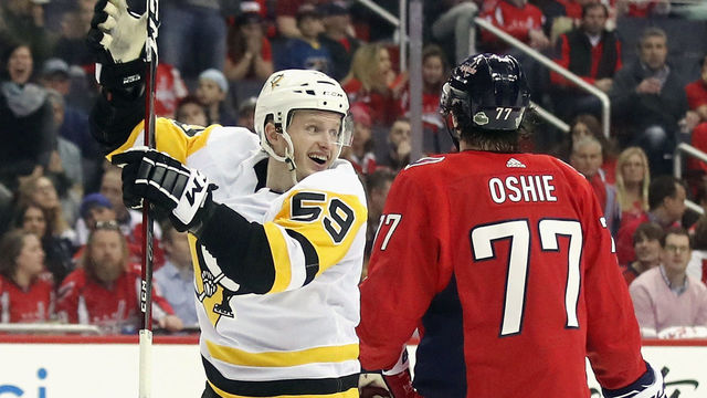 WASHINGTON, DC - APRIL 26: Jake Guentzel #59 of the Pittsburgh Penguins celebrates his game winning goal at 7:48 of the third period against the Washington Capitals in Game One of the Eastern Conference Second Round during the 2018 NHL Stanley Cup Playoffs at the Capital One Arena on April 26, 2018 in Washington, DC. The Penguins defeated the Capitals 3-2.