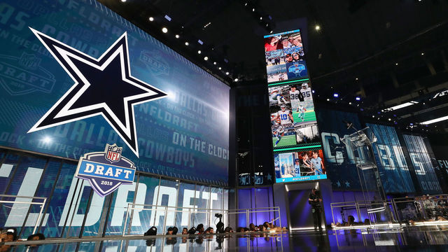 ARLINGTON, TX - APRIL 26: The Dallas Cowboys logo is seen on a video board during the first round of the 2018 NFL Draft at AT&T Stadium on April 26, 2018 in Arlington, Texas.