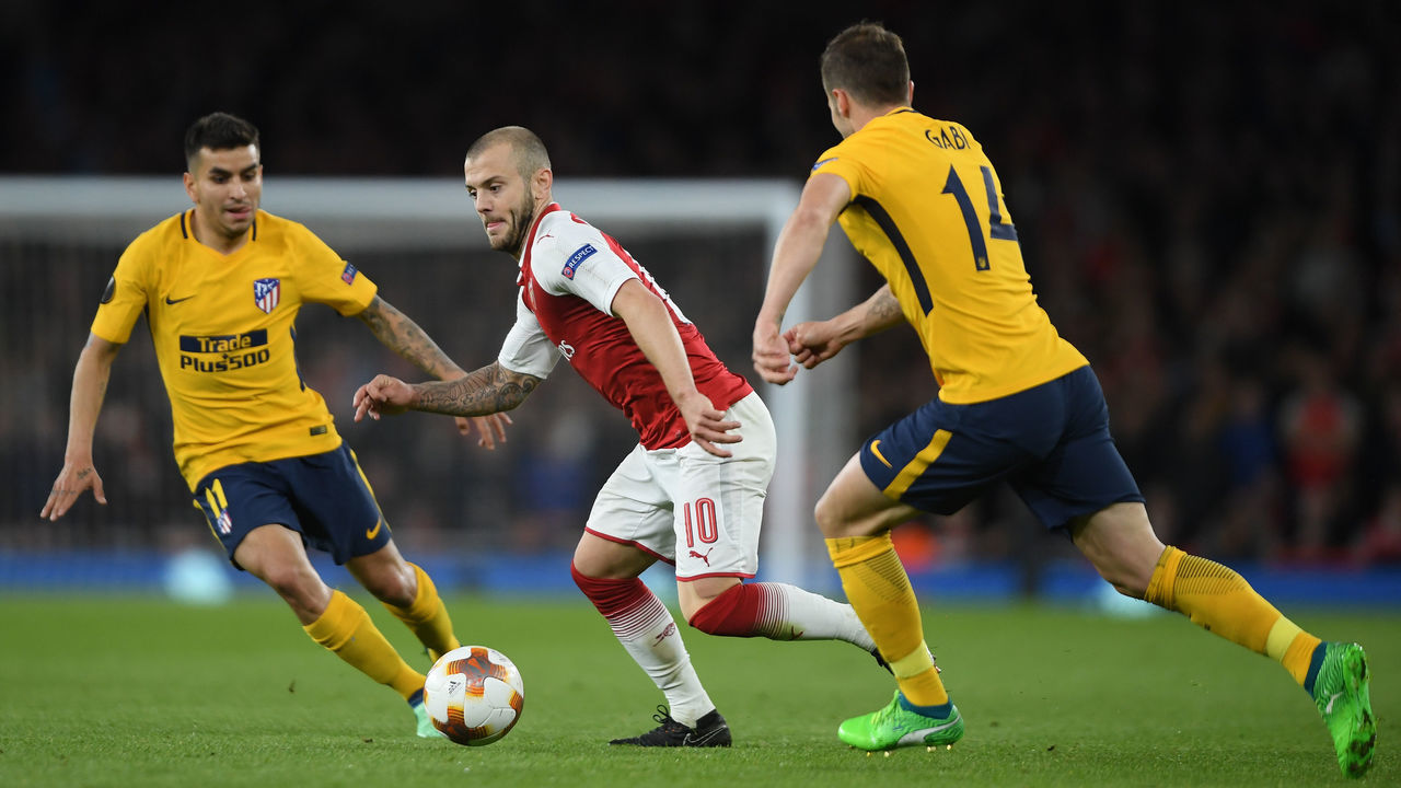 LONDON, ENGLAND - APRIL 26: Jack Wilshere of Arsenal is challenged by Angel Correa and Gabi of Atltico Madrid during the UEFA Europa League Semi Final leg one match between Arsenal FC and Atletico Madrid at Emirates Stadium on April 26, 2018 in London, United Kingdom.
