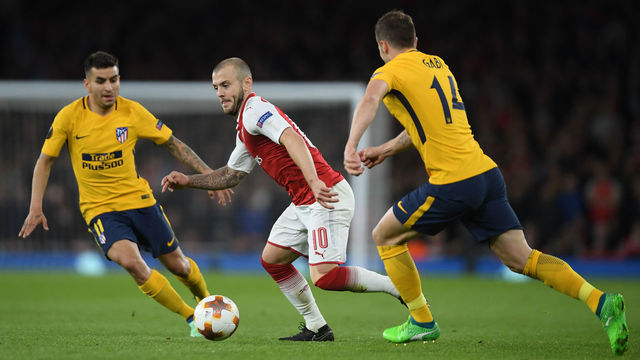 LONDON, ENGLAND - APRIL 26: Jack Wilshere of Arsenal is challenged by Angel Correa and Gabi of Atltico Madrid during the UEFA Europa League Semi Final leg one match between Arsenal FC and Atletico Madrid at Emirates Stadium on April 26, 2018 in London, United Kingdom.