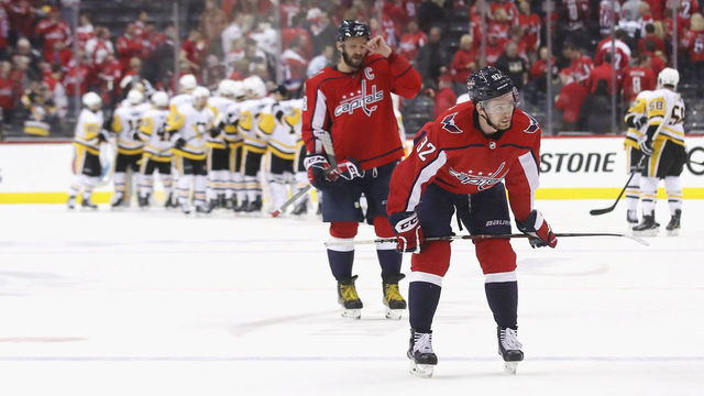 WASHINGTON, DC - APRIL 26: Alex Ovechkin #8 and Evgeny Kuznetsov #92 of the Washington Capitals leave the ice following A 3-2 loss to the Pittsburgh Penguins in Game One of the Eastern Conference Second Round during the 2018 NHL Stanley Cup Playoffs at the Capital One Arena on April 26, 2018 in Washington, DC.
