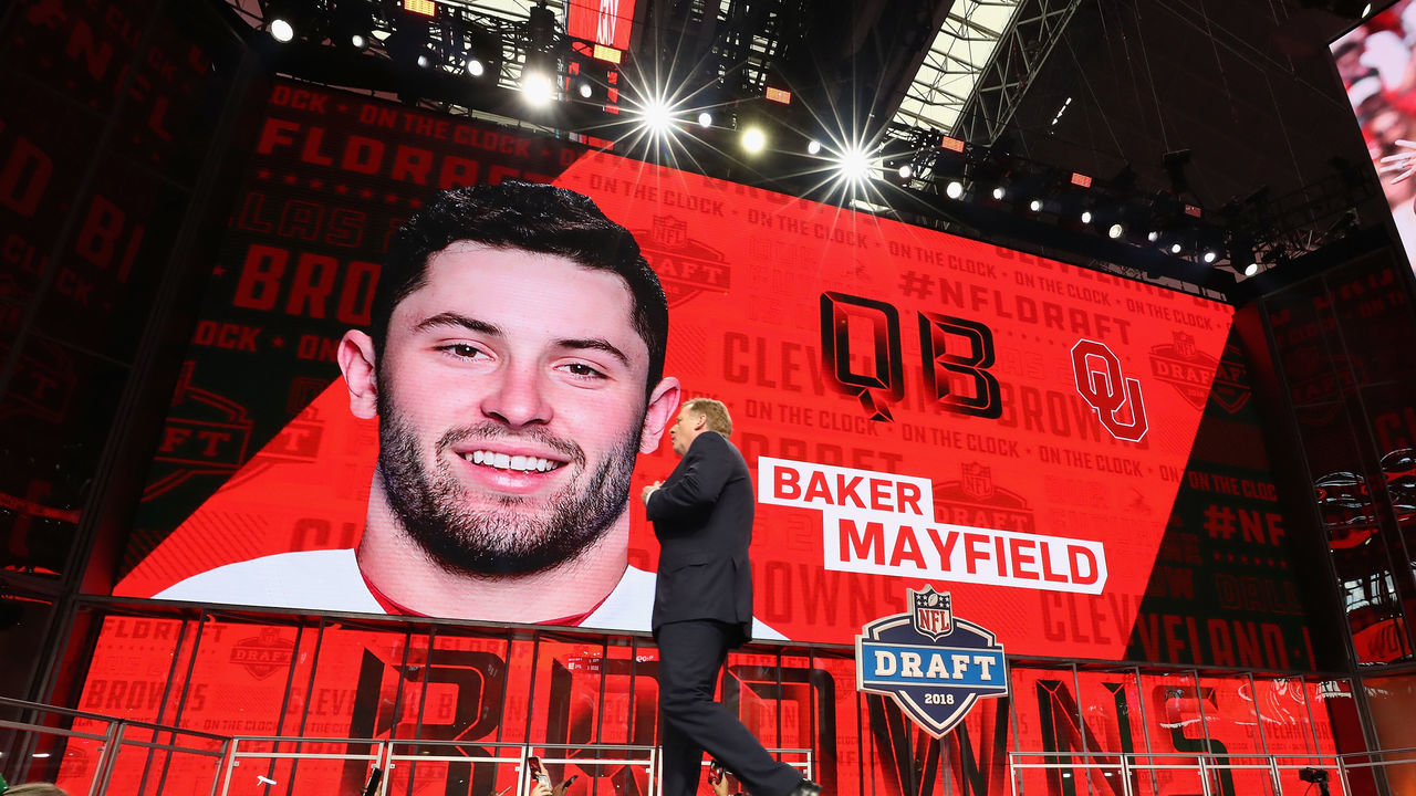 ARLINGTON, TX - APRIL 26: NFL Commissioner Roger Goodell walks past a video board displaying an image of Baker Mayfield of Oklahoma after he was picked #1 overall by the Cleveland Browns during the first round of the 2018 NFL Draft at AT&T Stadium on April 26, 2018 in Arlington, Texas.