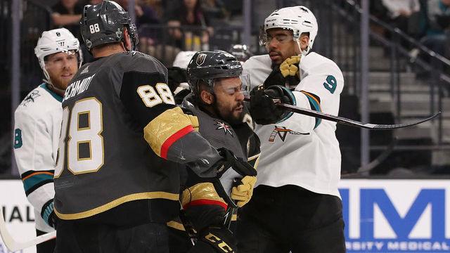 GLENDALE, NV - APRIL 26: Evander Kane #9 of the San Jose Sharks corss-checks Pierre-Edouard Bellemare #41 of the Vegas Golden Knights in the third period Game One of the Western Conference Second Round during the 2018 NHL Stanley Cup Playoffs at T-Mobile Arena on April 26, 2018 in Las Vegas, Nevada. The Golden Knights defeated the Sharks 7-0.