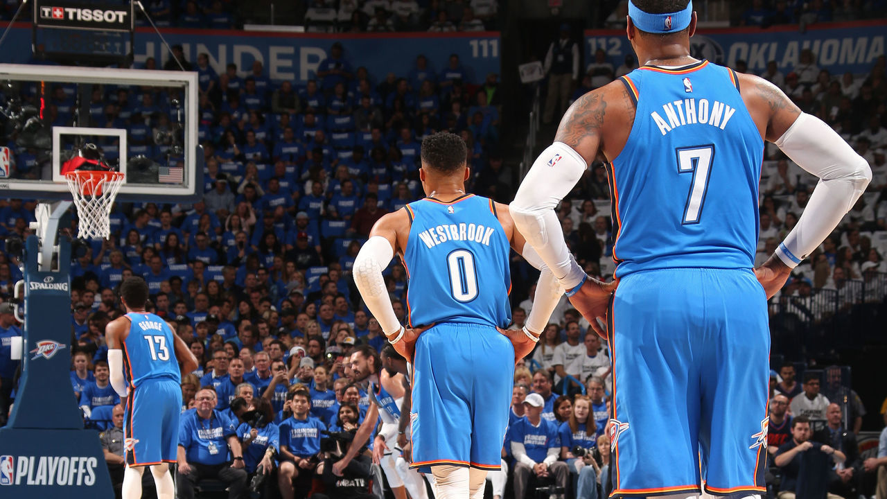 OKLAHOMA CITY, OK - APRIL 25: Carmelo Anthony #7 of the Oklahoma City Thunder and Russell Westbrook #0 of the Oklahoma City Thunder look on as Paul George #13 of the Oklahoma City Thunder shoots the ball against the Utah Jazz in Game Five of Round One of the 2018 NBA Playoffs on April 25, 2018 at Chesapeake Energy Arena in Oklahoma City, Oklahoma. Mandatory Copyright Notice: Copyright 2018 NBAE