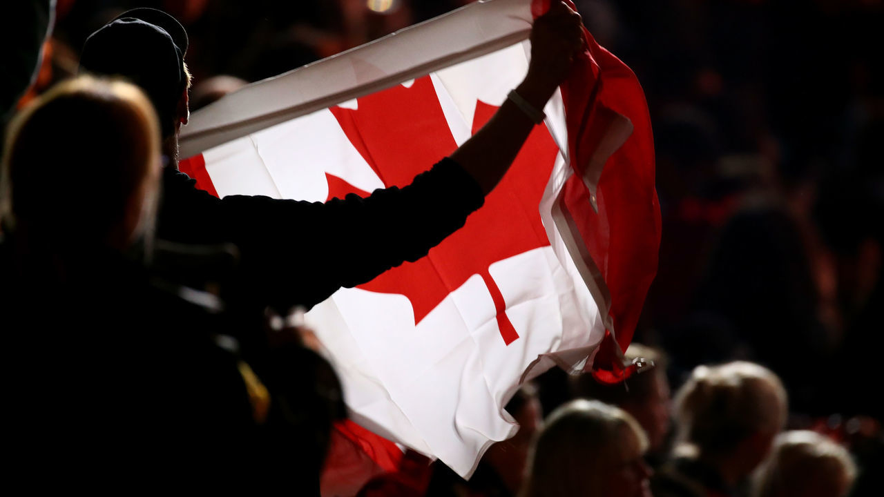 TORONTO, ON - SEPTEMBER 30: A fan waves a canadian flag during the closing ceremony of the Invictus Games 2017 at Air Canada Centre on September 30, 2017 in Toronto, Canada.