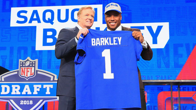 ARLINGTON, TX - APRIL 26: Saquon Barkley of Penn State poses with NFL Commissioner Roger Goodell after being picked #2 overall by the New York Giants during the first round of the 2018 NFL Draft at AT&T Stadium on April 26, 2018 in Arlington, Texas.