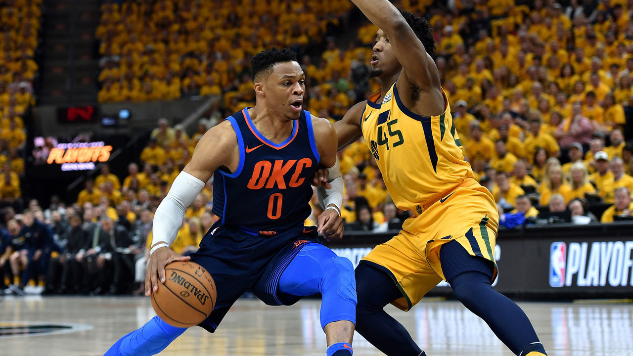 SALT LAKE CITY, UT - APRIL 27: Donovan Mitchell #45 of the Utah Jazz guards against Russell Westbrook #0 of the Oklahoma City Thunder in the first half during Game Six of Round One of the 2018 NBA Playoffs at Vivint Smart Home Arena on April 27, 2018 in Salt Lake City, Utah.
