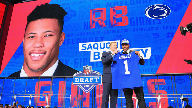 ARLINGTON, TX - APRIL 26: Saquon Barkley of Penn State poses with NFL Commissioner Roger Goodell after being picked #2 overall by the New York Giants during the first round of the 2018 NFL Draft at AT&T Stadium on April 26, 2018 in Arlington, Texas.