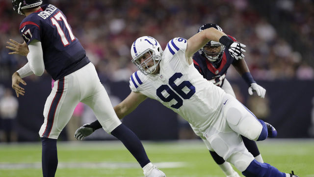 HOUSTON, TX - OCTOBER 16: Henry Anderson #96 of the Indianapolis Colts pressures Brock Osweiler #17 of the Houston Texans in the first quarter during the NFL game between the Indianapolis Colts and the Houston Texans at NRG Stadium on October 16, 2016 in Houston, Texas.