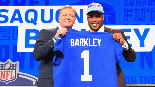 ARLINGTON, TX - APRIL 26: Saquon Barkley of Penn State poses with NFL Commissioner Roger Goodell after being picked #2 overall by the New York Giants during the first round of the 2018 NFL Draft at AT&T Stadium on April 26, 2018 in Arlington, Texas.
