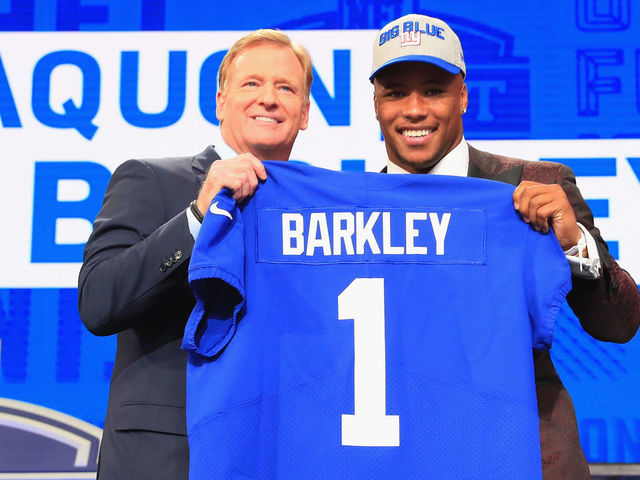 ARLINGTON, TX - APRIL 26: Saquon Barkley of Penn State poses with NFL Commissioner Roger Goodell after being picked #2 overall by the New York Giants during the first round of the 2018 NFL Draft at AT&T Stadium on April 26, 2018 in Arlington, Texas.