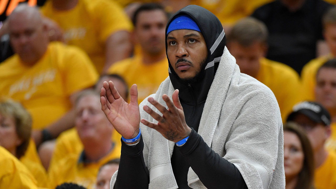 SALT LAKE CITY, UT - APRIL 21: Carmelo Anthony #7 of the Oklahoma City Thunder cheers from the bench in the first half during Game Three of Round One of the 2018 NBA Playoffs against the Utah Jazz at Vivint Smart Home Arena on April 21, 2018 in Salt Lake City, Utah.