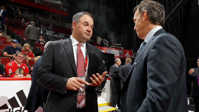 CHICAGO, IL - JUNE 23: Pierre Dorion and Joe Sakic meet during the 2017 NHL Draft at the United Center on June 23, 2017 in Chicago, Illinois.