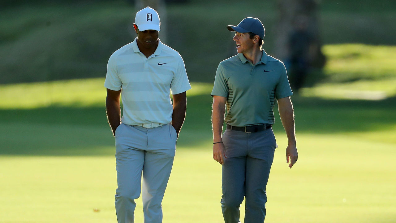 PACIFIC PALISADES, CA - FEBRUARY 16: Tiger Woods and Rory McIlroy of Northern Ireland walk across the 17th hole during the second round of the Genesis Open at Riviera Country Club on February 16, 2018 in Pacific Palisades, California.