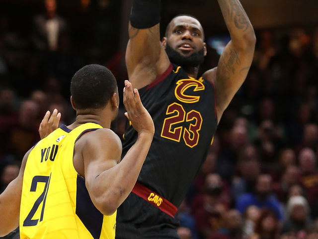 CLEVELAND, OH - APRIL 25: LeBron James #23 of the Cleveland Cavaliers takes a shot over Thaddeus Young #21 of the Indiana Pacers during the second half of Game Five of the Eastern Conference Quarterfinals during the 2018 NBA Playoffs at Quicken Loans Arena on April 25, 2018 in Cleveland, Ohio. Cleveland won the game 98-95 to take a 3-2 series lead.