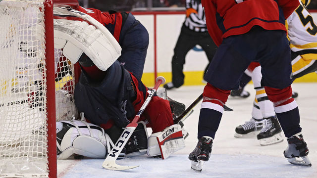 WASHINGTON, DC - APRIL 29: Goalie Braden Holtby #70 of the Washington Capitals makes a save on a shot by Patric Hornqvist #72 of the Pittsburgh Penguins during the third period in Game Two of the Eastern Conference Second Round during the 2018 NHL Stanley Cup Playoffs at Capital One Arena on April 29, 2018 in Washington, DC.