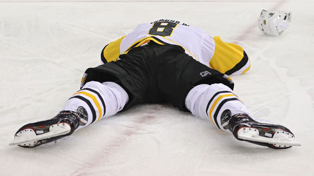 WASHINGTON, DC - APRIL 29: Brian Dumoulin #8 of the Pittsburgh Penguins lays on the ice injured against the Washington Capitals during the second period in Game Two of the Eastern Conference Second Round during the 2018 NHL Stanley Cup Playoffs at Capital One Arena on April 29, 2018 in Washington, DC.